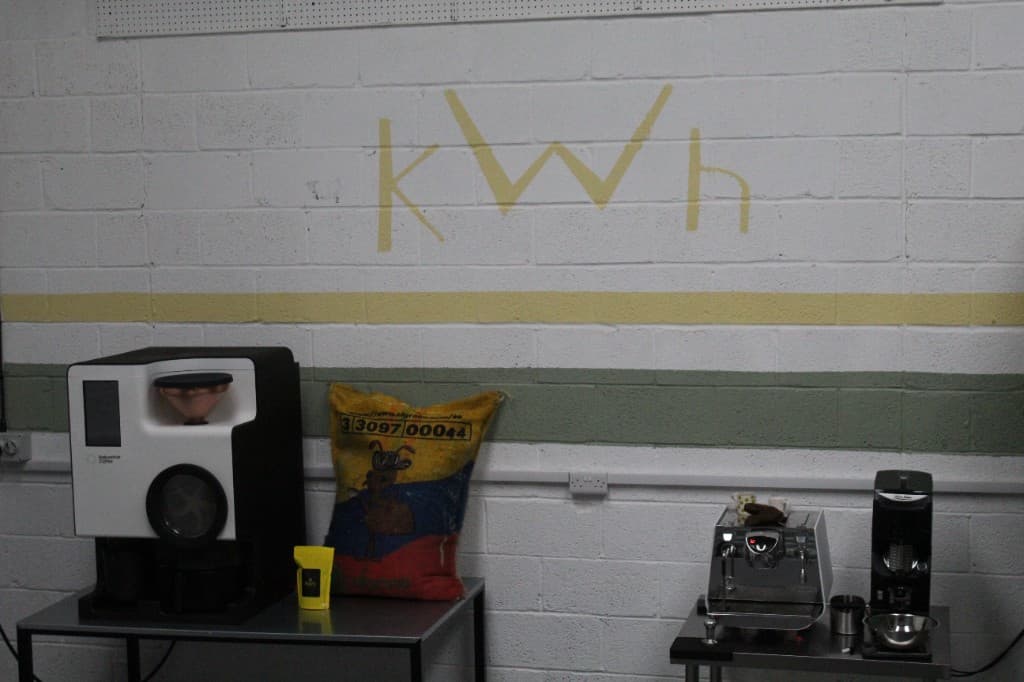 Inside the kWh Coffee roastery at the Raylor Centre, York — Bellwether electric roaster and La Marzocco espresso machine