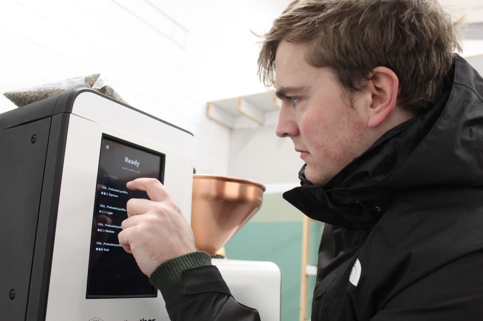 Shaun dialling in a roast profile on the Bellwether touchscreen at the kWh roastery in York